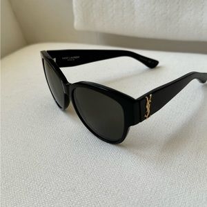 YSL classic black sunglasses with gold emblem logo on the side.